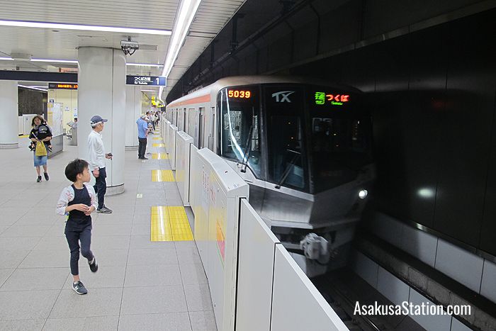 A train arriving at Platform 1 TX Asakusa Station