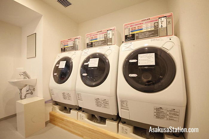 Coin-operated laundromat for hotel guests