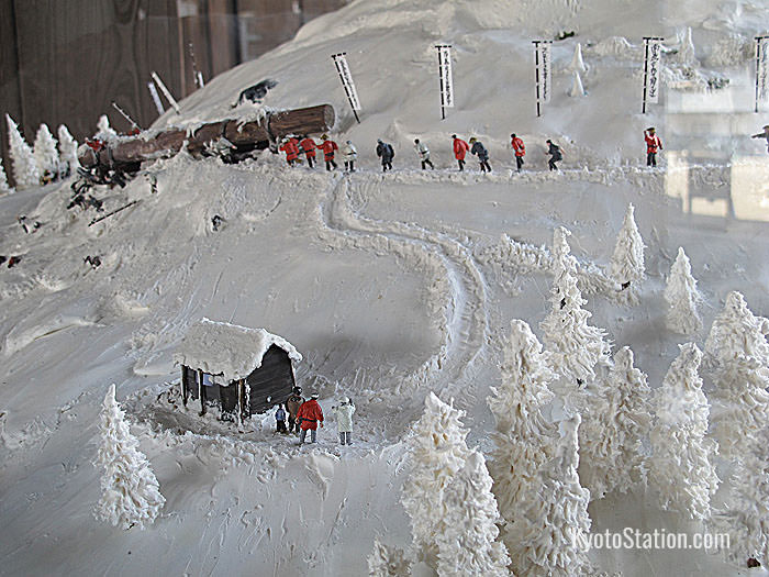 The diorama of lumber being transported from the mountains