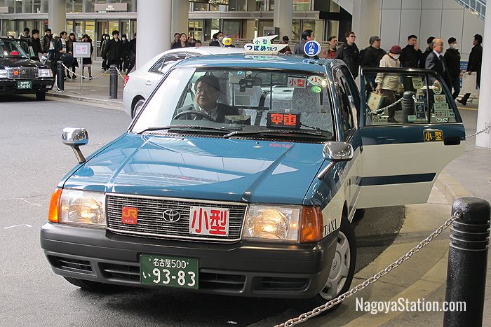 A taxi at Nagoya Station with its automatic door open
