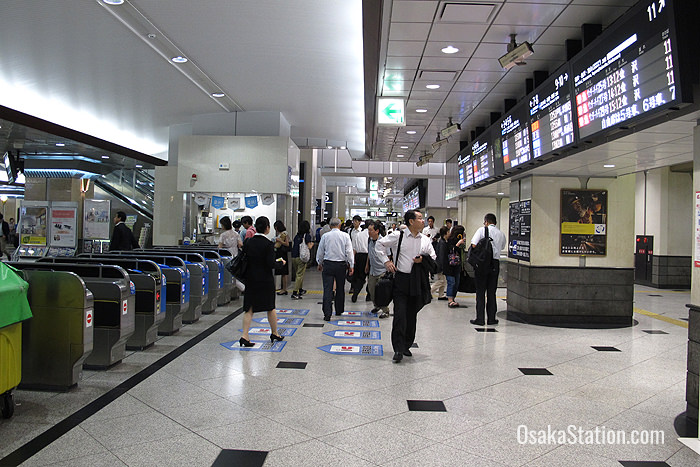 Information on departures is displayed inside the ticket gates