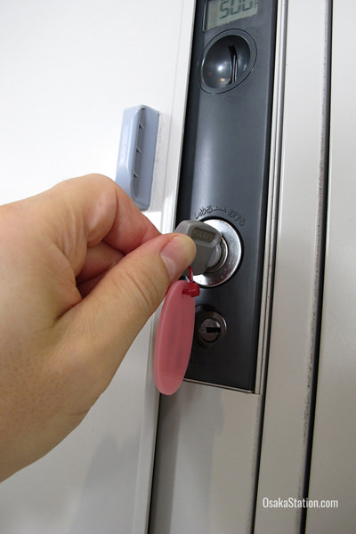 An old fashioned coin locker with a key