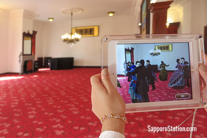 Viewing the room with the tablet reveals a Western-style ball of the 19th century