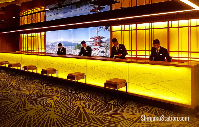 The renovated lobby features a sleek front desk with LCD screens showing eye-popping views of Japan
