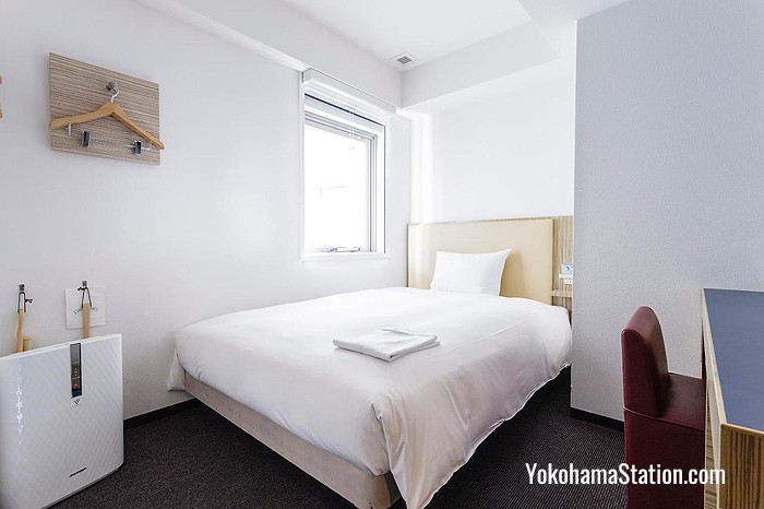 A room with a double bed